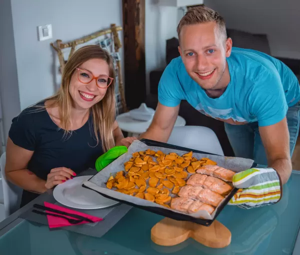 Salmon and sweet potatoes in an oven